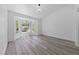 Bright bedroom with wood floors, bay window, and modern light fixture at 2208 Spring Water Dr, Las Vegas, NV 89134