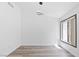 Simple yet stylish bedroom with wood-look flooring and modern ceiling light at 2208 Spring Water Dr, Las Vegas, NV 89134