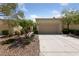 Charming single-story home with desert landscaping and a spacious two-car garage at 2208 Spring Water Dr, Las Vegas, NV 89134
