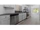 Well-lit kitchen featuring stainless steel appliances and sleek countertops at 2208 Spring Water Dr, Las Vegas, NV 89134