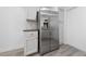 Modern kitchen boasts stainless steel refrigerator and white cabinets at 2208 Spring Water Dr, Las Vegas, NV 89134