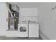 Washer and dryer in garage with utility sink at 2208 Spring Water Dr, Las Vegas, NV 89134