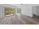 Living room boasts new floors and sliding glass doors to the outside at 2208 Spring Water Dr, Las Vegas, NV 89134