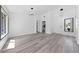 Open-concept living room featuring modern lighting, new floors, and large windows at 2208 Spring Water Dr, Las Vegas, NV 89134