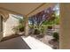 Covered patio overlooking backyard and desert landscaping at 2208 Spring Water Dr, Las Vegas, NV 89134
