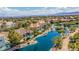 Aerial view of estate home with defined property lines, a pool, and a serene lake backdrop at 2209 Glenbrook Way, Las Vegas, NV 89117