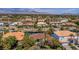 Scenic aerial view of a luxury estate with lush landscaping and serene lake views at 2209 Glenbrook Way, Las Vegas, NV 89117