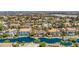 Beautiful community aerial view featuring a lake and multiple homes, showcasing the serene neighborhood at 2209 Glenbrook Way, Las Vegas, NV 89117