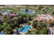 Aerial view of a clubhouse overlooking a pool, golf course, and landscaped grounds at 2209 Glenbrook Way, Las Vegas, NV 89117