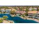 Aerial view of home featuring a backyard pool, surrounded by lake and palm trees at 2209 Glenbrook Way, Las Vegas, NV 89117