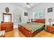 This bedroom has a large wooden bed, two side tables and lots of natural light at 2209 Glenbrook Way, Las Vegas, NV 89117