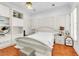 Bright bedroom with white furniture, built-in shelving, and shuttered windows at 2209 Glenbrook Way, Las Vegas, NV 89117