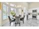 Sunlit breakfast nook with views of the backyard pool through white plantation shutters at 2209 Glenbrook Way, Las Vegas, NV 89117