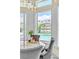 Elegant dining area featuring a view of the pool through shuttered windows, blending indoor and outdoor living at 2209 Glenbrook Way, Las Vegas, NV 89117