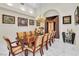 Dining room with large wood table and seating for twelve at 2209 Glenbrook Way, Las Vegas, NV 89117