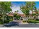 Beautiful single-story home with tile roof, lush landscaping and driveway at 2209 Glenbrook Way, Las Vegas, NV 89117