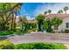 Eye-catching single-story home with well-manicured lawn, driveway, and lush landscaping at 2209 Glenbrook Way, Las Vegas, NV 89117