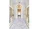 Grand foyer with marble floors, a stunning chandelier, and decorative, gold-accented doors at 2209 Glenbrook Way, Las Vegas, NV 89117