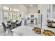Bright, modern kitchen featuring sleek white cabinetry and stainless steel appliances at 2209 Glenbrook Way, Las Vegas, NV 89117