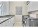 Clean laundry room with modern appliances, a utility sink, and storage space at 2209 Glenbrook Way, Las Vegas, NV 89117