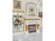 This fireplace features luxurious gold embellishments, framed pictures and artwork, glass displays, and contemporary lighting at 2209 Glenbrook Way, Las Vegas, NV 89117
