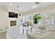 Cozy living room boasting large windows, fireplace, and marble floors at 2209 Glenbrook Way, Las Vegas, NV 89117