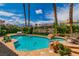 Beautiful backyard pool and landscaping with palm trees at 2209 Glenbrook Way, Las Vegas, NV 89117