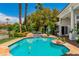 Beautiful backyard pool and landscaping features water feature at 2209 Glenbrook Way, Las Vegas, NV 89117