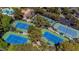 Multiple community tennis courts surrounded by lush landscaping at 2209 Glenbrook Way, Las Vegas, NV 89117