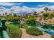 Scenic view of a tranquil water feature surrounded by lush greenery and landscaping in a serene neighborhood at 2209 Glenbrook Way, Las Vegas, NV 89117