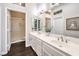 Bright bathroom featuring double sinks with modern fixtures and a separate shower at 2330 Spring Water Dr, Las Vegas, NV 89134