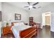 Comfortable bedroom featuring a ceiling fan, hardwood floors, and natural light at 2330 Spring Water Dr, Las Vegas, NV 89134