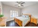 Cozy bedroom with wood floors, shuttered window, ceiling fan and natural light at 2330 Spring Water Dr, Las Vegas, NV 89134