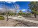 Community space featuring walking path, trees, shrubs and a bench at 2330 Spring Water Dr, Las Vegas, NV 89134