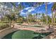 Well-maintained community miniature golf course with mature trees at 2330 Spring Water Dr, Las Vegas, NV 89134