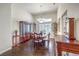 Elegant dining room featuring hardwood floors, matching furniture, and modern lighting fixture at 2330 Spring Water Dr, Las Vegas, NV 89134