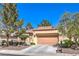 Inviting single-story house with desert landscaping, a tile roof, and two car garage at 2330 Spring Water Dr, Las Vegas, NV 89134