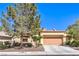 Charming single-story home with a well-manicured front yard and two car garage at 2330 Spring Water Dr, Las Vegas, NV 89134