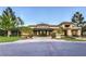 Striking exterior with manicured lawn, decorative landscaping, and circular entry at 2330 Spring Water Dr, Las Vegas, NV 89134
