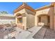 Inviting front entrance with a tiled roof and desert landscaping on a sunny day at 2330 Spring Water Dr, Las Vegas, NV 89134