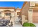 Welcoming home entrance with a tiled roof, desert landscaping, and decorative ironwork at 2330 Spring Water Dr, Las Vegas, NV 89134