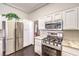 Functional kitchen featuring stainless steel appliances and ample counter space at 2330 Spring Water Dr, Las Vegas, NV 89134