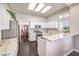Well-lit kitchen with granite counters, stainless steel appliances, and an open layout at 2330 Spring Water Dr, Las Vegas, NV 89134