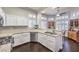 Bright kitchen with white cabinets, stainless steel appliances, and granite countertops at 2330 Spring Water Dr, Las Vegas, NV 89134