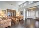 Bright living room with a high ceiling, hardwood floors, and traditional furnishings at 2330 Spring Water Dr, Las Vegas, NV 89134