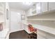 Well-lit office space with a built-in desk, shelves, and ample storage cabinets at 2330 Spring Water Dr, Las Vegas, NV 89134