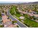 Scenic aerial view of a community featuring lush green spaces and well-maintained homes at 2383 Rainswept Ave, Henderson, NV 89052