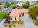 Stunning aerial shot showcasing a well-manicured home with lush landscaping and driveway at 2383 Rainswept Ave, Henderson, NV 89052