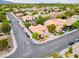 Aerial view of home with a private yard, mature landscaping, and neighborhood street at 2383 Rainswept Ave, Henderson, NV 89052