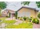 Exterior view of a charming home with well-maintained yard, patio, and mature trees at 2383 Rainswept Ave, Henderson, NV 89052